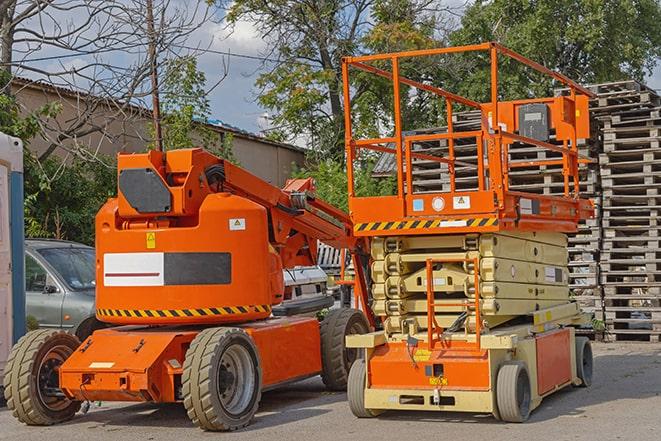 warehouse worker operating forklift to stack inventory in Clewiston