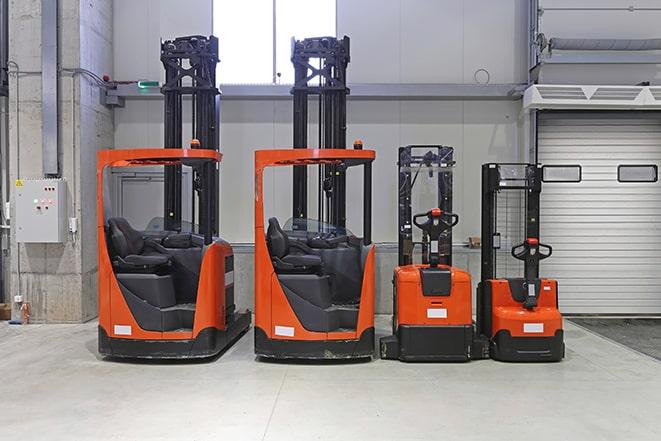 forklifts in a distribution center, handling goods